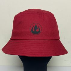 This bucket hat, inspired by the ferocious Fire Nation, is the perfect, understated accessory to complete a fierce, fun look. Whether you're going to a convention, or just a day out in the sun, this is the hat for you! *Fits most adult heads. Red Bucket Hat For Streetwear, Women's Balaclava, Fire Nation, Girls Camp, Bucket Hats, Granny Square, Warm Winter, Caps Hats, Bucket Hat