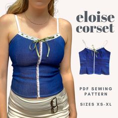 a woman wearing a blue top and white skirt with the words eloise corset on it