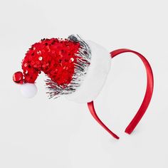 The Girls' Sequins Santa Hat Headband by Cat & Jack™ Red adds a festive sparkle to any holiday outfit. Featuring a cute Santa hat design covered in shimmering sequins, this headband is perfect for Christmas parties, school events or family gatherings. Made from soft, lightweight material, it provides a comfortable fit. Fun and festive, this headband is a must-have accessory to spread holiday cheer and complete any Christmas look. Cat & Jack™ - Designed for all children so you can trust it's made Adjustable Mini Hats For Christmas Party, Adjustable Red Mini Hat For Holidays, Adjustable Christmas Party Hats, Holiday Mini Hats With Headband, Holiday Headband Mini Hats, Holiday Mini Hat Headband, Christmas Party Adjustable Hair Accessories, Adjustable Christmas Holiday Headband, Adjustable Headband For Holiday Festivities