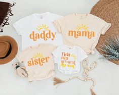 three t - shirts with the words,'daddy, first trip around the sun '