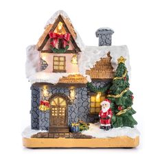 a small christmas house with lights and decorations