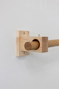 a wooden object mounted to the side of a wall