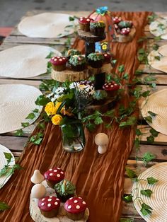 the table is decorated with mushrooms and flowers