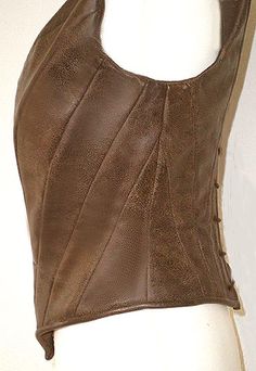 a brown leather top on a mannequin head