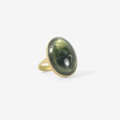 Details Lola Brooks 18k yellow gold & large oval green tourmaline ring, size 6 1/4. The 16.36ct stone measures approximately 7/8″ x 5/8″ & is set on top of an 18k yellow gold band that tapers from approximately 1/16″ to 1/8″. - green tourmaline, 16.36ct - 18k yellow gold - size 6 1/4 Sizing This ring can be resized. Please allow 2 - 6 weeks. Inquire about sizing fee. Green Oval Sapphire Ring For Formal Occasions, Gold Oval Tourmaline Ring, Green Oval Dome Ring For Formal Occasions, Luxury Oval Green Dome Ring, Oval Tourmaline Emerald Ring In Yellow Gold, Green Oval Gemstone Dome Ring, Green Oval Cabochon Dome Ring, Green Oval Dome Ring With Polished Finish, Green Tourmaline Ring