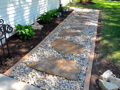 a walkway made out of stones and gravel