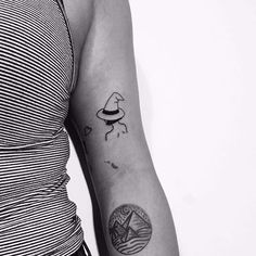 a woman with a small tattoo on her arm