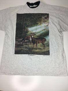 Vintage 1984 Gray T-Shirt Whitetail Deer Randy McGovern Size XL. Graphic is in great condition - not much cracking just light fading. There is a small light spot stain near bottom hem on front. There is a run in the fabric on the front in the center on the bottom hem. See photos. Shipped with USPS First Class Package. 24” armpit to armpit 27 3/4” length Thrift Aesthetic, Deer Shirt, Owl T Shirt, Vintage Deer, White Tail, Vintage Owl, Whitetail Deer, Fuzzy Sweater, Hunting Shirts