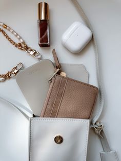 Artfully organize your belongings with THE CÆP's Mate Mini Crossbody. We believe the Mini Mate is the perfect accessory for basically any activity! Crafted with vegan leather, this chic accessory features an adjustable strap (19" min. drop, 23" max. drop), a main compartment that fits all phones with slim cases plus other essentials, an interior back pocket for cards and receipts. Plus, it has a ring for extra clip-on options, magnetic closure, and light gold hardware. Measurements of the Bag: W Chic Accessories, Mini Crossbody, Slim Case, Magnetic Closure, Back Pocket, Gold Hardware, Vegan Leather, Adjustable Straps, Off White