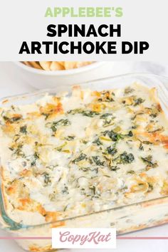 spinach artichoke dip in a casserole dish with text overlay