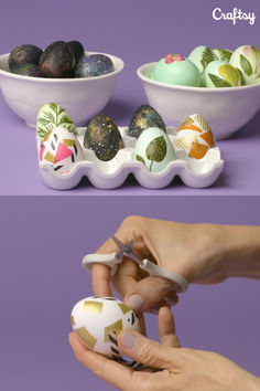 an egg is being held by two hands and placed in front of a bowl filled with painted eggs