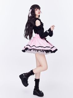 High-waisted skirt adorned with double rows of lace-up details, ruffles and heart shaped buttons, featuring a loose elastic waist, black lace trimmed hemline.   	 		 			Size 			S 			M 			L 		 		 			Full Length (Lace trim not included) 			41 			42 			43 		 		 			Waist 			66-96 			70-100 			74-104 Harajuku Ruffled Mini Skirt, Harajuku Style Ruffled Mini Skirt, Harajuku Mini Skirt With Ruffles, Harajuku Style Mini Skirt With Ruffles, Harajuku Style Ruffled Skirt Bottoms, Harajuku Style Pink Ruffled Bottoms, Harajuku Style Pink Ruffled Skirt, Pink Harajuku Ruffle Skirt, Pink Harajuku Skirt With Ruffles