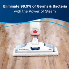 a steam mop is on the floor with steam coming from it