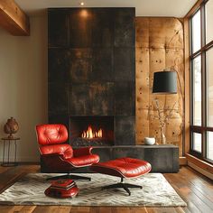 a red chair and ottoman in front of a fireplace with wood paneling on the wall