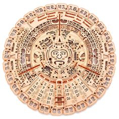 an intricately designed wooden clock with numbers and symbols on the face is shown in this image