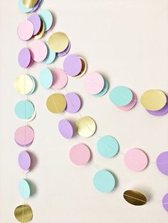 paper circles and confetti on a white background