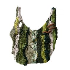 a crocheted bag is shown on a white background with green and brown stripes