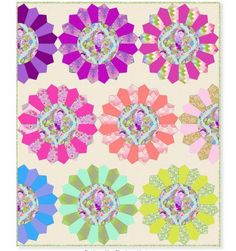 a bunch of different colored flowers on a white background with the words, quilts and sew