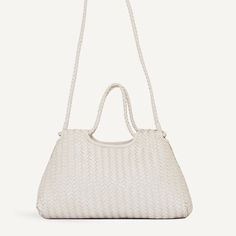 A standout piece to wear everyday. The wide, angular shape dresses up any outfit. Features a removable shoulder strap, so you can wear it long over your shoulder, crossbody, or slipped through your arm. The bell curve shaped top handle is made from one piece that forms an infinite loop. The Woven Crossbody Strap and Adjustable Crossbody Strap are included with the Gabine Bag. Make it a shoulder bag with the Woven Shoulder Strap. Bell Curve, Tailored Coat, Bold Jewelry, Crossbody Strap, Top Handle, Sale Items, Shoulder Strap, Hand Weaving, One Piece