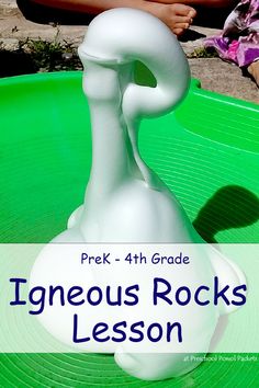 a white sculpture sitting on top of a green table with text overlay reading prek - 4th grade igneous rocks lesson