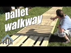 a man kneeling down on top of a wooden planked walkway with the words pallet walk way in front of him