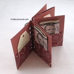 the folded gift pocket book is open and has money in it