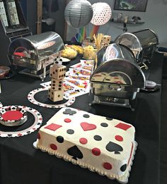 a table topped with lots of cakes and desserts covered in fondant polka dots