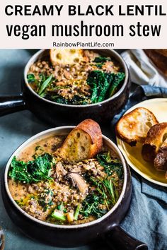 two bowls of creamy black lentil vegan mushroom stew with bread on the side