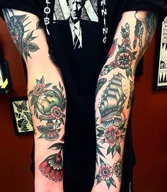 a man with many tattoos on his arms