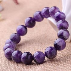 material：Amethyst bead size: 6mm 8mm 10mm 12mm 6mm approx 28-29 beads 8mm approx 22-23 beads 10mm approx 18-19 beads 12mm approx 16-17 beads Color: purple Gem Stone Bracelet, Amethyst Beaded Bracelet, Peace Bracelet, Amethyst Bracelet Beads, Balance Bracelet, Bracelets With Meaning, Crystal Healing Bracelets, Simple Bracelets, Elegant Bracelet