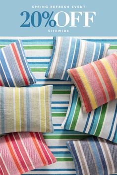 colorful striped pillows with the words 20 % off on them and in front of it