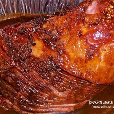 a close up of a meat in a pan with sauce on the top and bottom