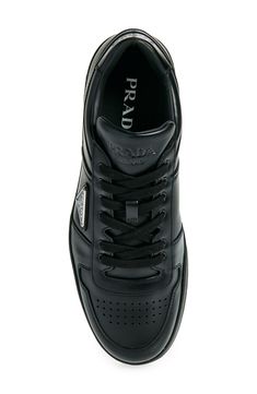 Three different versions of the iconic Prada logo brand this sporty sneaker done in supple leather and finished with a perforated toe for breathability. Lace-up style Removable insole Leather upper and lining/rubber sole Made in Italy Designer Shoes Sporty Sneakers With Embossed Logo In Calf Leather, Sporty Sneakers With Embossed Logo And Calf Leather, Sporty Calf Leather High-top Sneakers With Perforations, Classic Sneakers With Perforations, Designer Sports Sneakers With Embossed Logo, High-top Calf Leather Sneakers With Perforations, High-top Calf Leather Sneakers With Perforated Toe Box, Sporty Calf Leather Sneakers With Perforated Toe Box, Calf Leather High-top Sneakers With Perforations