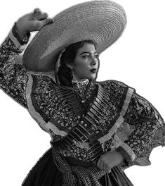 a woman wearing a large hat and dress