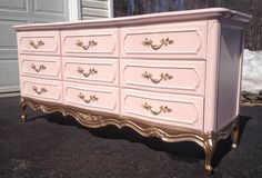 an old dresser is painted pink and gold