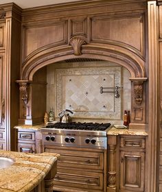 a kitchen with wooden cabinets and marble counter tops in the center is shown on an instagram page