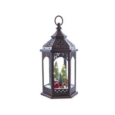 a decorative lantern with christmas trees in it