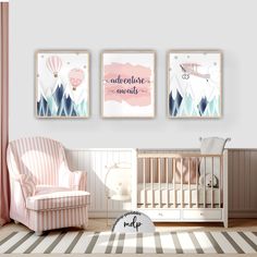 a baby's room with three posters on the wall