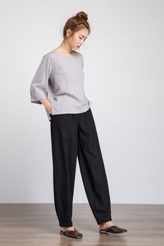 "This Black linen pants is crafted in soft black linen , the linen pants featuring a fitted waist with pleated detail , the linen baggy Pants has two pockets on both side. Wear This vintage and retro inspired long pants and enjoy your casual weekend. As you see, the linen pants have a special waist design, it is by zipper and button closed, and have elastic waist in the side. it prefectly shown your slim waistline. DETAIL * 50% linen , 50% cotton blend * Zipper And Buttons Closure * Side pockets Wide-leg Linen Harem Pants For Work, Chic Linen Harem Pants For Spring, Spring Chic Linen Harem Pants, Linen Wide Leg Harem Pants For Work, Chic Relaxed Fit Linen Harem Pants, Chic Linen Relaxed Fit Harem Pants, Solid High-waisted Linen Harem Pants, Linen Harem Pants For Workwear, Office Linen Ankle-length Harem Pants