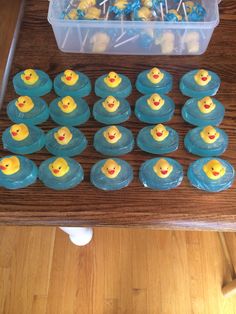 there are cupcakes with yellow rubber ducks on them