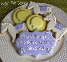 some cookies that are on a plate with the words sadie up, jocellyn's getting hitched