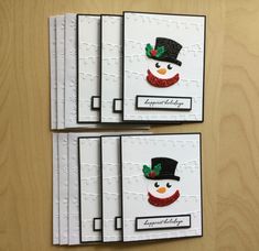 three cards with snowmen and hats on them