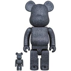 a black and white bear is next to a small gray teddy bear on a white background