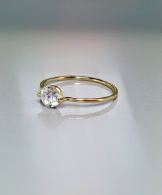 Simple and unique Floating Stone Ring. This ring is Extremely cute and Dainty also for stacking, thumb or midi and a great addition for your collection or as a perfect gift. --Great for Baby/kids as birthstone Rings. --14k/10k Real Solid Gold --Band Thickness: 1.0mm --CZ approx : 3mm wide = 0.10 ctw --Diamond Option: Natural .10 ct Si quality ** Limited time SALE ** Order Yours Today Please message me for larger size! SALE!! Great Value! **Dainty Rings On SALE Now** **100% Quality Guaranteed** - Minimalist Yellow Gold Birthstone Ring For Everyday, 14k Gold Minimalist Crystal Ring As A Gift, Everyday Yellow Gold Crystal Ring With Birthstone, Minimalist 14k Gold Crystal Ring Gift, 14k Gold Crystal Ring For Everyday, Everyday Fine Jewelry Solitaire Ring, Everyday 14k Gold Dainty Birthstone Ring, Everyday Stackable Rings With Prong Setting, Delicate Yellow Gold Birthstone Ring With Prong Setting