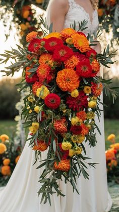 a bride holding a large bouquet of flowers