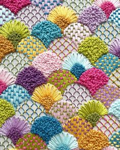 the colorful crocheted afghan is made with yarn