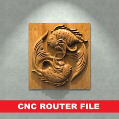 a wooden plaque with two fish on it and the words cnc router file