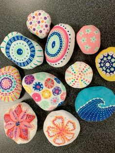 painted rocks with different designs on them