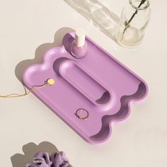 a purple tray sitting on top of a white table