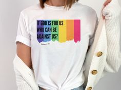 Rainbow Flag, Romans 8:31 lgbt Christian Tshirt, Rainbow lgbt Shirt, lgbt Christian Gift, lgbt Ally, Ally Shirt, lgbt Christian Faith TShirt  Embrace the intersection of faith and love with our LGBT Christian apparel. This thoughtfully crafted garment celebrates the beautiful diversity within the LGBTQ+ community while honoring the deeply rooted Christian values of acceptance, inclusion, and unconditional love. Designed with meticulous attention to detail, our apparel features a comfortable and Pre-shrunk Crew Neck Shirt For Pride, Cotton T-shirt With Rainbow Print For Pride, Graphic Tee With Rainbow Print For Pride, Rainbow Print Graphic Tee For Pride, Rainbow Graphic Print Tops For Pride, White Pre-shrunk T-shirt For Pride, White Text Print Tops For Pride, White Pre-shrunk Top For Pride, White Rainbow Pride T-shirt